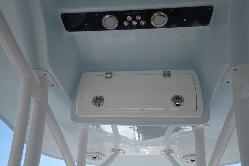 Slide: The Image of 2020 Sea Fox 249 Avenger boat console with storage compartment and controls. - 33