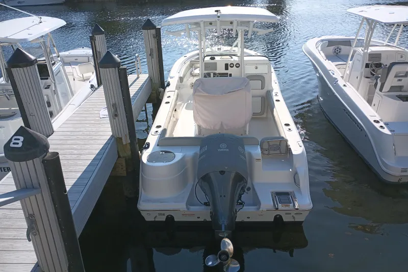 Slide: The Image of 2020 Sea Fox 249 Avenger boat docked at marina, rear view with Yamaha engine. - 36