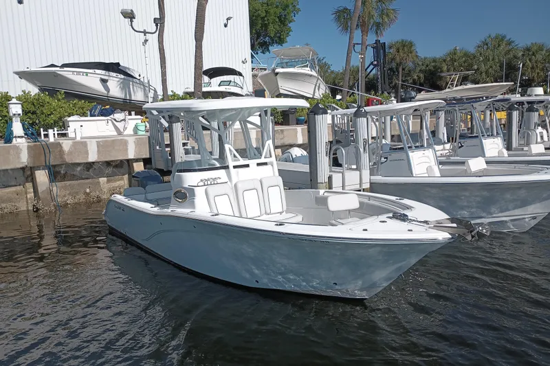 Slide: The Image of 2020 Sea Fox 249 Avenger boat docked in marina under clear blue sky. - 37