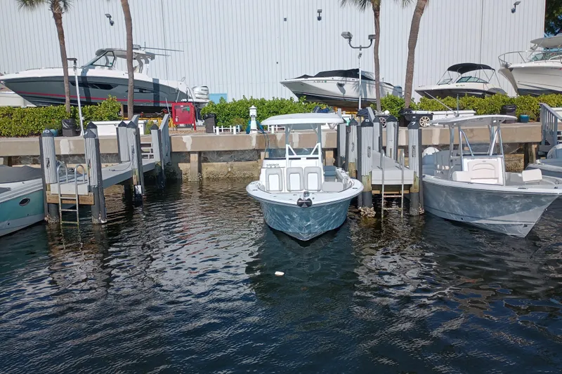 Slide: The Image of 2020 Sea Fox 249 Avenger boat docked at marina with other vessels. - 40