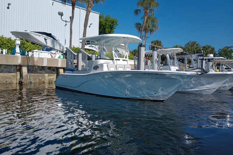 Slide: The Image of 2020 Sea Fox 249 Avenger boat docked in marina under clear blue sky. - 42
