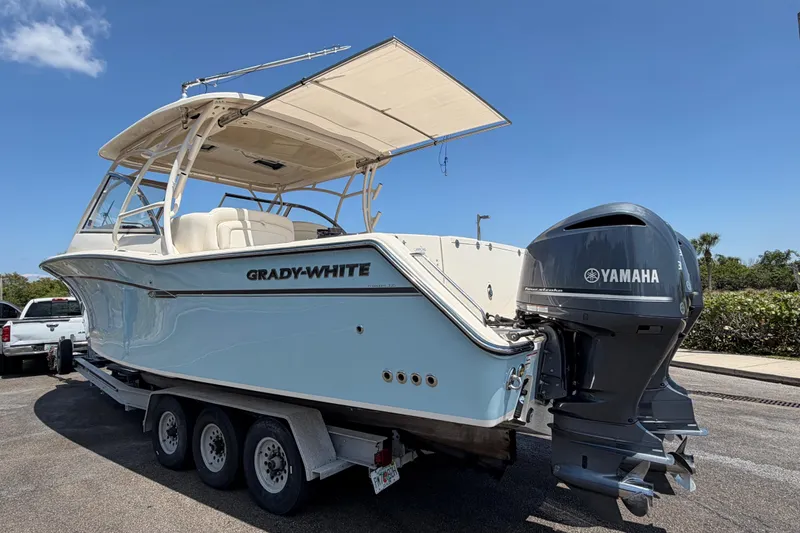 Slide: The Image of 2018 Grady-White Freedom 335 boat on trailer with Yamaha outboard motor. - 13