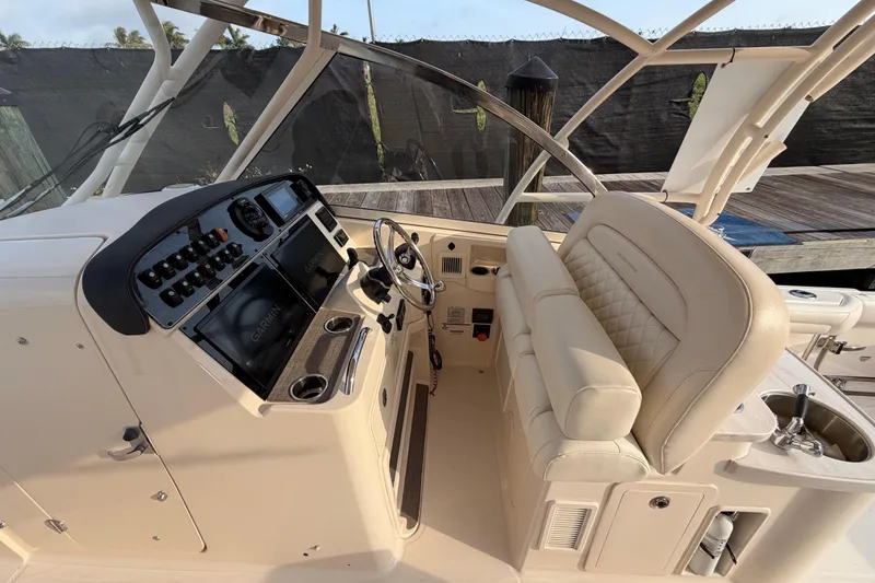 Slide: The Image of Control panel of 2018 Grady-White Freedom 335 boat with Garmin display and joystick. - 18