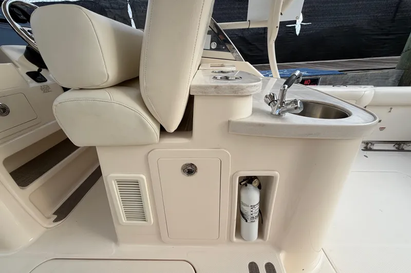 Slide: The Image of 2018 Grady-White Freedom 335 boat interior with sink and seating area. - 31