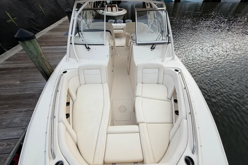 Slide: The Image of 2018 Grady-White Freedom 335 boat with spacious seating at dockside. - 35