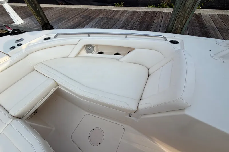 Slide: The Image of 2018 Grady-White Freedom 335 boat interior with white cushioned seating. - 37