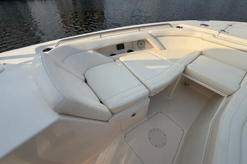 Slide: The Image of Luxurious seating area on a 2018 Grady-White Freedom 335 boat, near calm waters. - 38