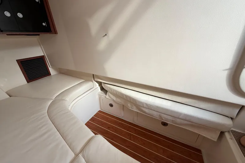 Slide: The Image of Interior of 2018 Grady-White Freedom 335 boat, featuring seating and control panel. - 42