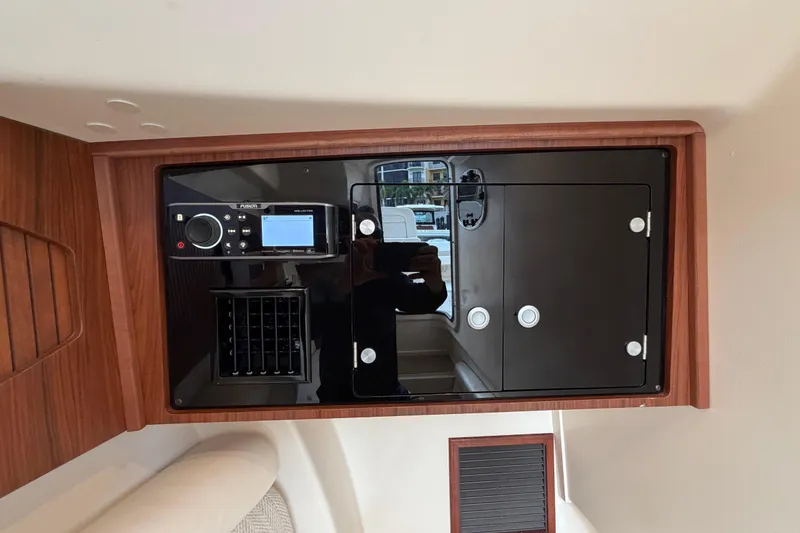Slide: The Image of Cabin air conditioner controls on 2018 Grady-White Freedom 335 boat, displaying 65 degrees. - 45