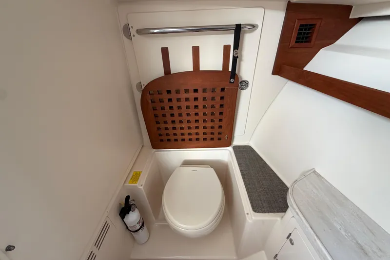 Slide: The Image of Interior of 2018 Grady-White Freedom 335 boat with sink and wooden flooring. - 48