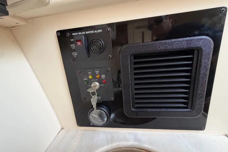 Slide: The Image of 2018 Grady-White Freedom 335 boat bathroom with toilet and wooden accents. - 50