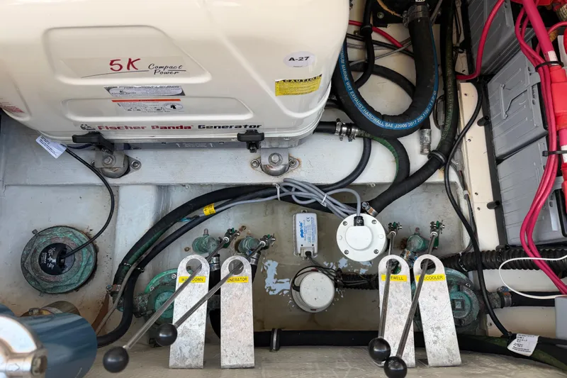 Slide: The Image of Engine compartment of a 2018 Grady-White Freedom 335 with Fischer Panda generator. - 54