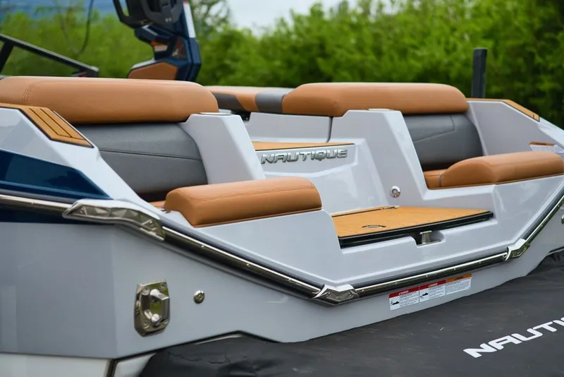 Slide: The Image of 2022 Nautique Super Air Nautique G23 boat rear with luxurious seating. - 10