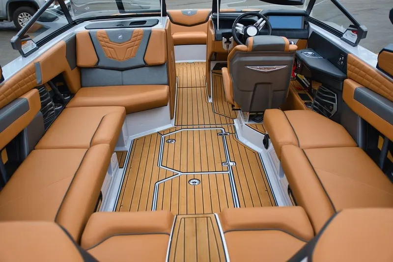 Slide: The Image of Interior of 2022 Nautique Super Air Nautique G23 with luxurious seating. - 11