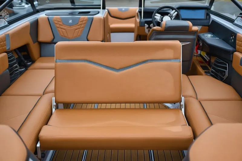 Slide: The Image of Interior of 2022 Nautique Super Air Nautique G23 with luxurious leather seating. - 14