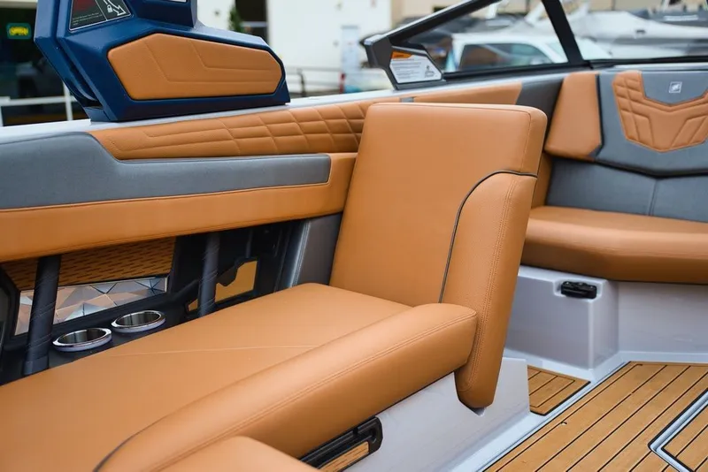 Slide: The Image of Interior of 2022 Nautique Super Air Nautique G23 with brown leather seats. - 15