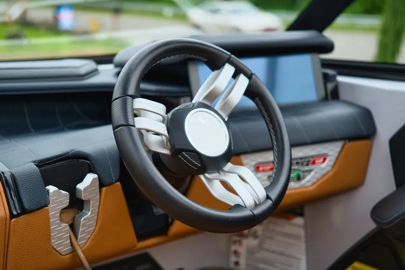 Slide: The Image of Steering wheel of 2022 Nautique Super Air Nautique G23 boat. - 16