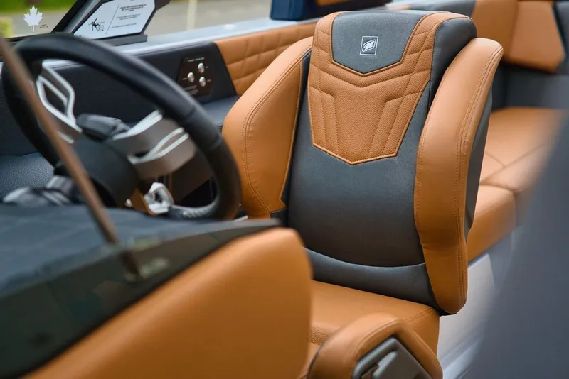 Slide: The Image of Interior of 2022 Nautique Super Air Nautique G23 with luxurious seating. - 17