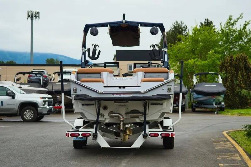 Slide: The Image of 2022 Nautique Super Air Nautique G23 in a parking lot. - 6