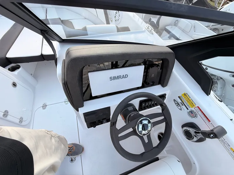 Slide: The Image of Interior view of 2026 Stingray 20 SBX boat cockpit with Simrad controls. - 27