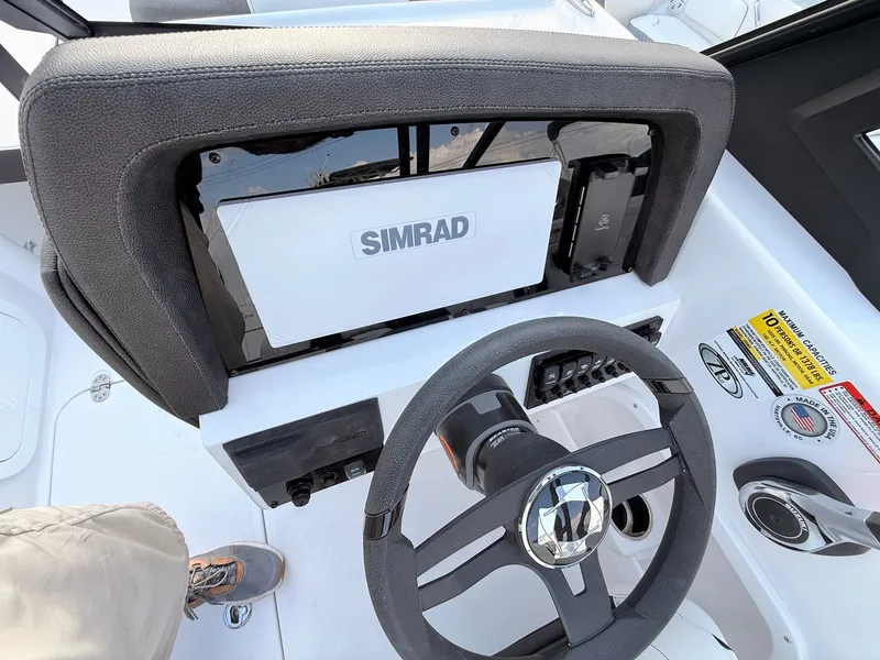 Slide: The Image of 2026 Stingray 20 SBX boat dashboard with Simrad display. - 28