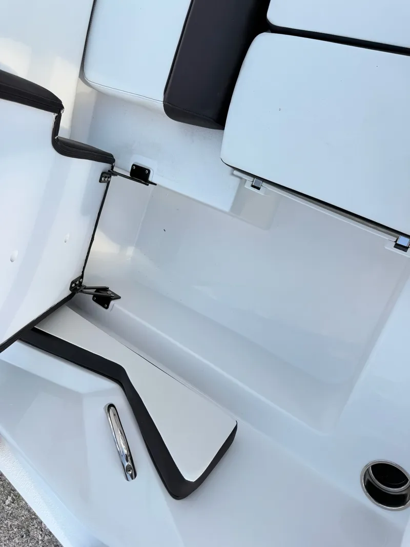 Slide: The Image of Interior of 2026 Stingray 20 SBX boat, white and black upholstery. - 29