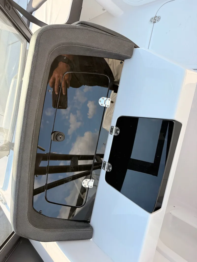 Slide: The Image of 2026 Stingray 20 SBX boat cabin with black glass door design. - 31