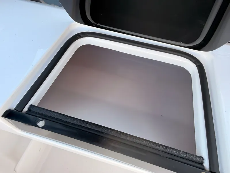 Slide: The Image of Stingray 20 SBX 2026 boat hatch with black sealing frame. - 32