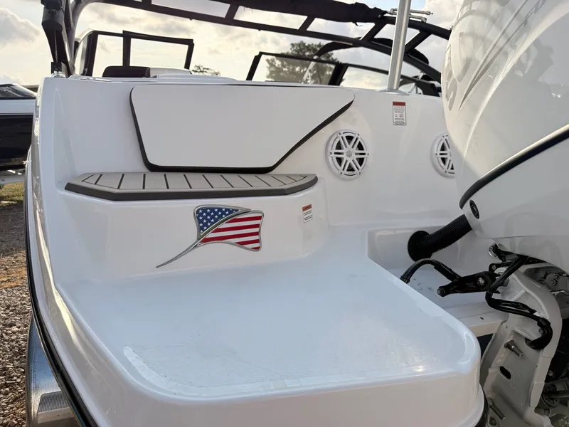 Slide: The Image of 2026 Stingray 20 SBX boat with American flag and speakers. - 43