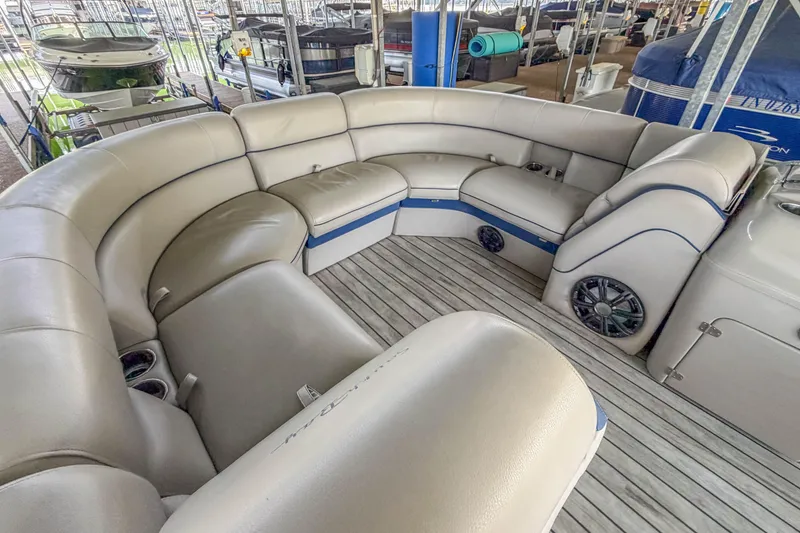 Slide: The Image of Luxurious seating area on a 2017 South Bay 523 RS pontoon boat, featuring plush upholstery. - 6