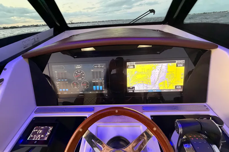 Slide: The Image of Dashboard of 2021 Chris-Craft Catalina 34 with navigation and control displays. - 11