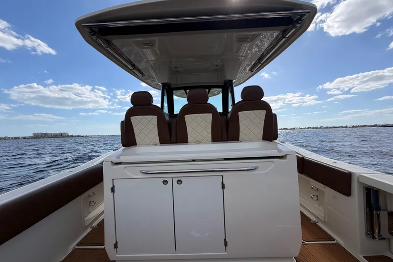 Slide: The Image of 2021 Chris-Craft Catalina 34 boat interior with luxurious seating on open water. - 17