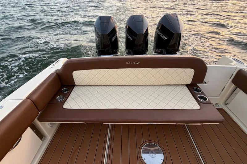 Slide: The Image of 2021 Chris-Craft Catalina 34 boat with luxurious seating and triple Mercury engines. - 22