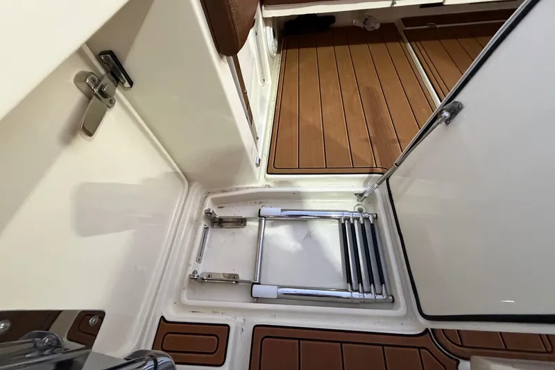 Slide: The Image of 2021 Chris-Craft Catalina 34 boat interior with teak flooring and foldable ladder. - 27