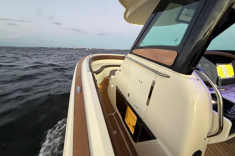 Slide: The Image of 2021 Chris-Craft Catalina 34 cruising on open water at sunset. - 29