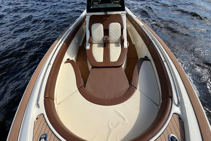 Slide: The Image of 2021 Chris-Craft Catalina 34 boat interior with luxurious seating on open water. - 31