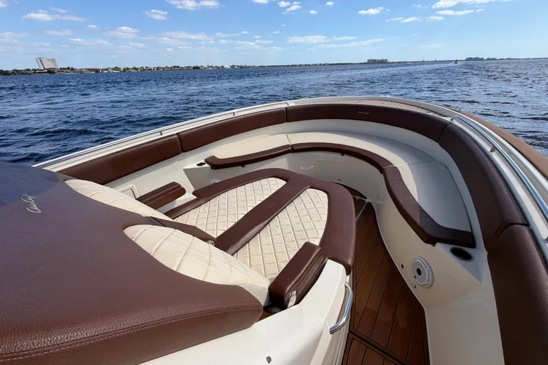 Slide: The Image of 2021 Chris-Craft Catalina 34 boat interior with luxurious seating on open water. - 34