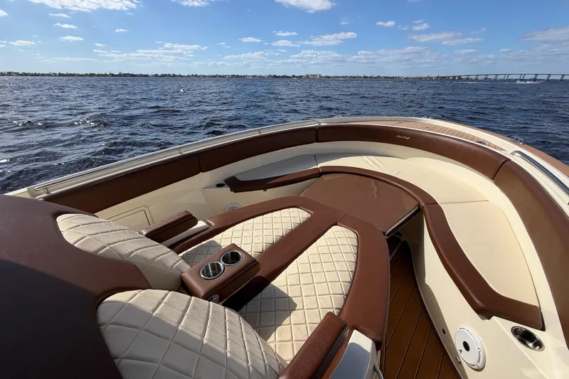Slide: The Image of 2021 Chris-Craft Catalina 34 boat interior with luxurious seating on open water. - 36