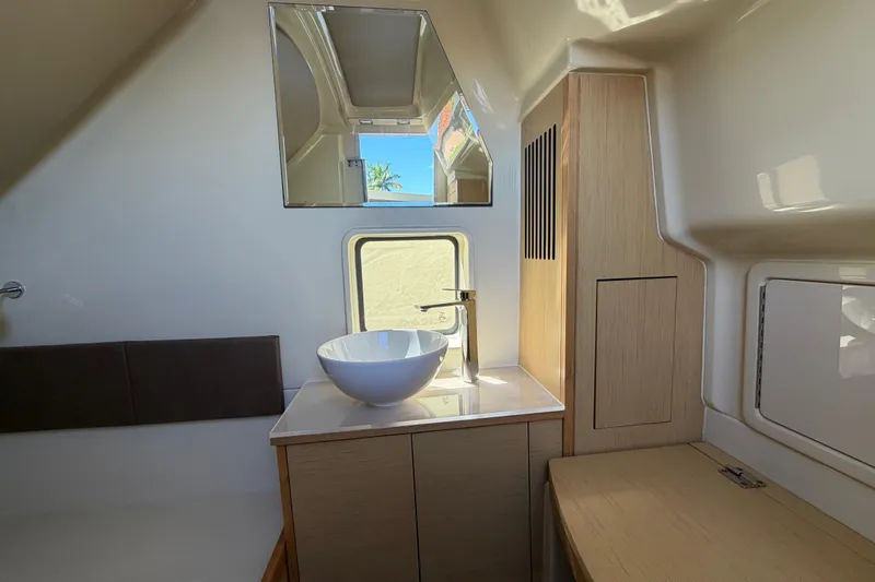 Slide: The Image of 2021 Chris-Craft Catalina 34 interior bathroom with modern sink and mirror. - 39