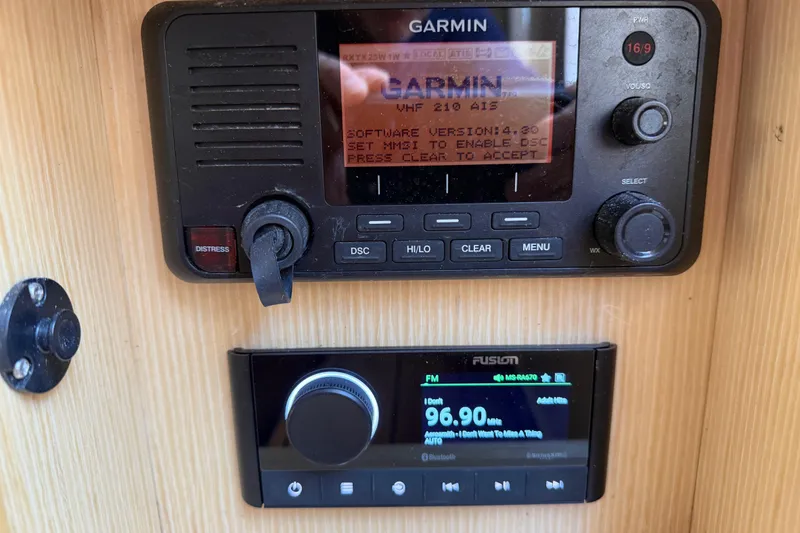 Slide: The Image of Garmin and Fusion marine radios on 2021 Chris-Craft Catalina 34 boat dashboard. - 40