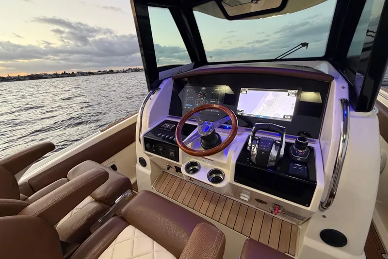 Slide: The Image of 2021 Chris-Craft Catalina 34 helm with modern navigation system and luxurious seating. - 8