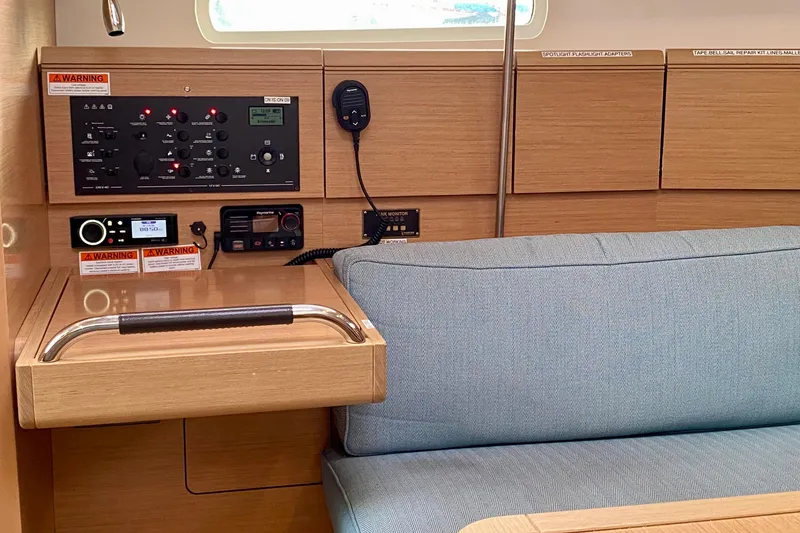 Slide: The Image of Portside view showing Nav-desk control panel and Turquoise Blue seating. - 15