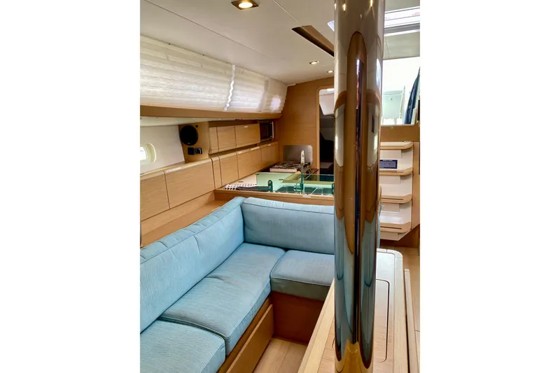 Slide: The Image of Starboard Saloon showing Convertible Seating w/Double Drop-leaf Dinette. - 18