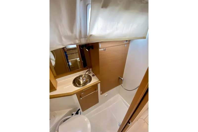 Slide: The Image of Aft Portside Head with sink and shower. - 20