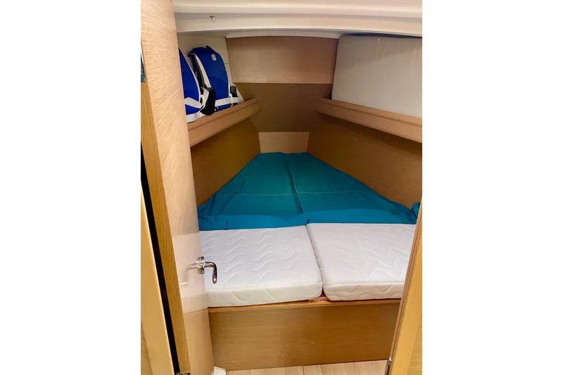 Slide: The Image of Owners Forward Double Berth with Blue Protective Cover over Original Mattress. - 22