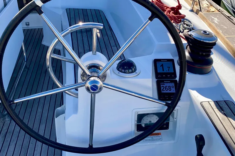 Slide: The Image of Starboard Helm with Multi-function Nav display and Autopilot and engine controls. - 27
