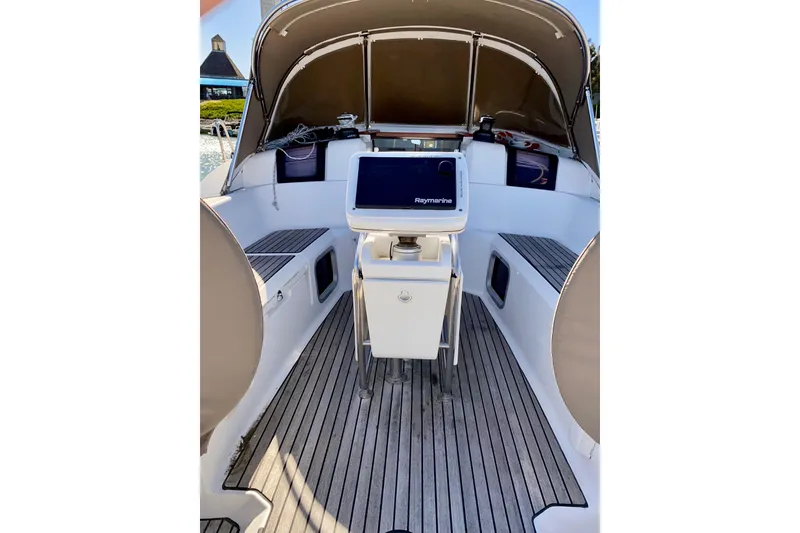 Slide: The Image of Large Cockpit with Double Drop-leaf Fixed Table, Large Screen Raymarine nav, Teak Sole. - 5