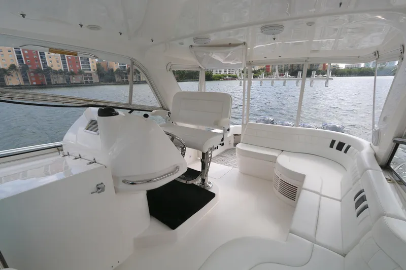 Slide: The Image of Luxurious interior of 2012 Intrepid 475 Sport Yacht with white seating and helm station. - 11