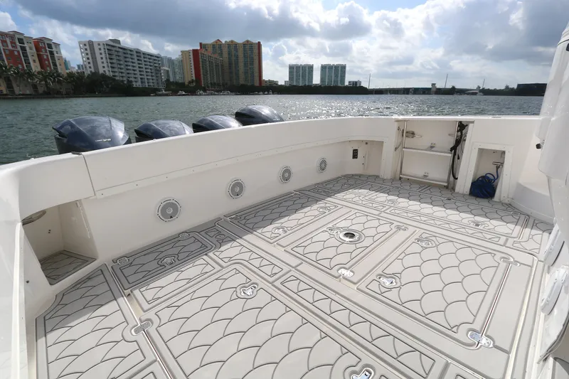 Slide: The Image of Spacious deck of 2012 Intrepid 475 Sport Yacht with scenic waterfront view. - 16