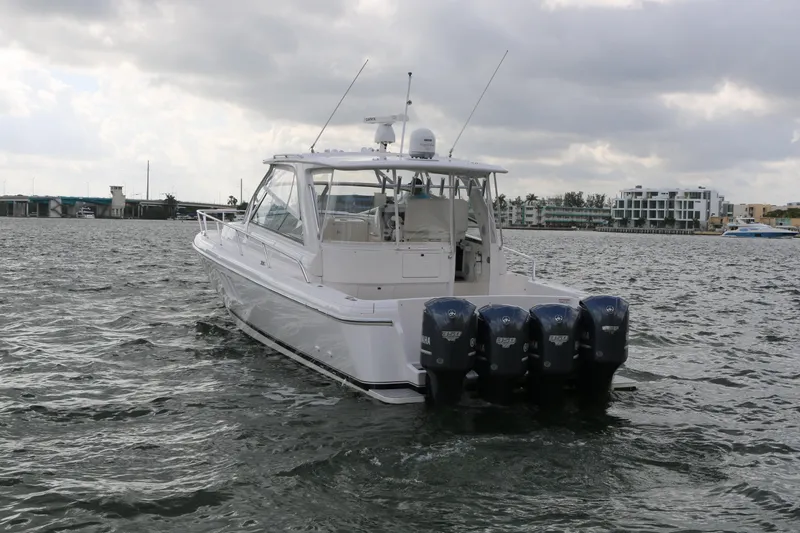 Slide: The Image of 2012 Intrepid 475 Sport Yacht with four outboard engines on a cloudy day. - 22